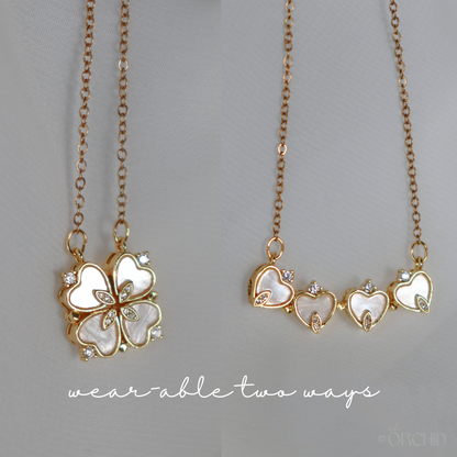 Two gold necklaces with heart designs.