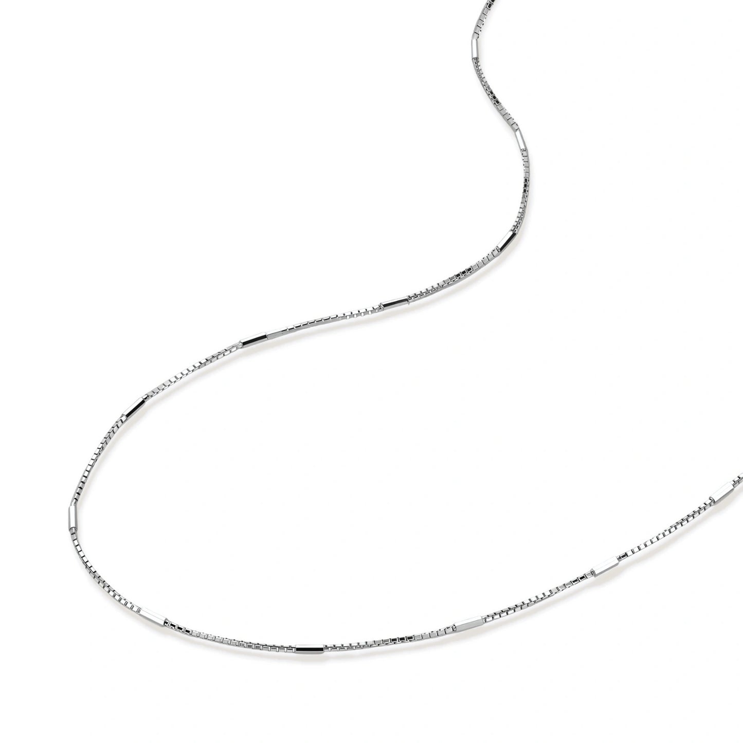 Silver chain necklace on a white background