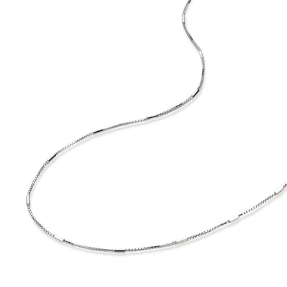 Silver chain necklace on a white background