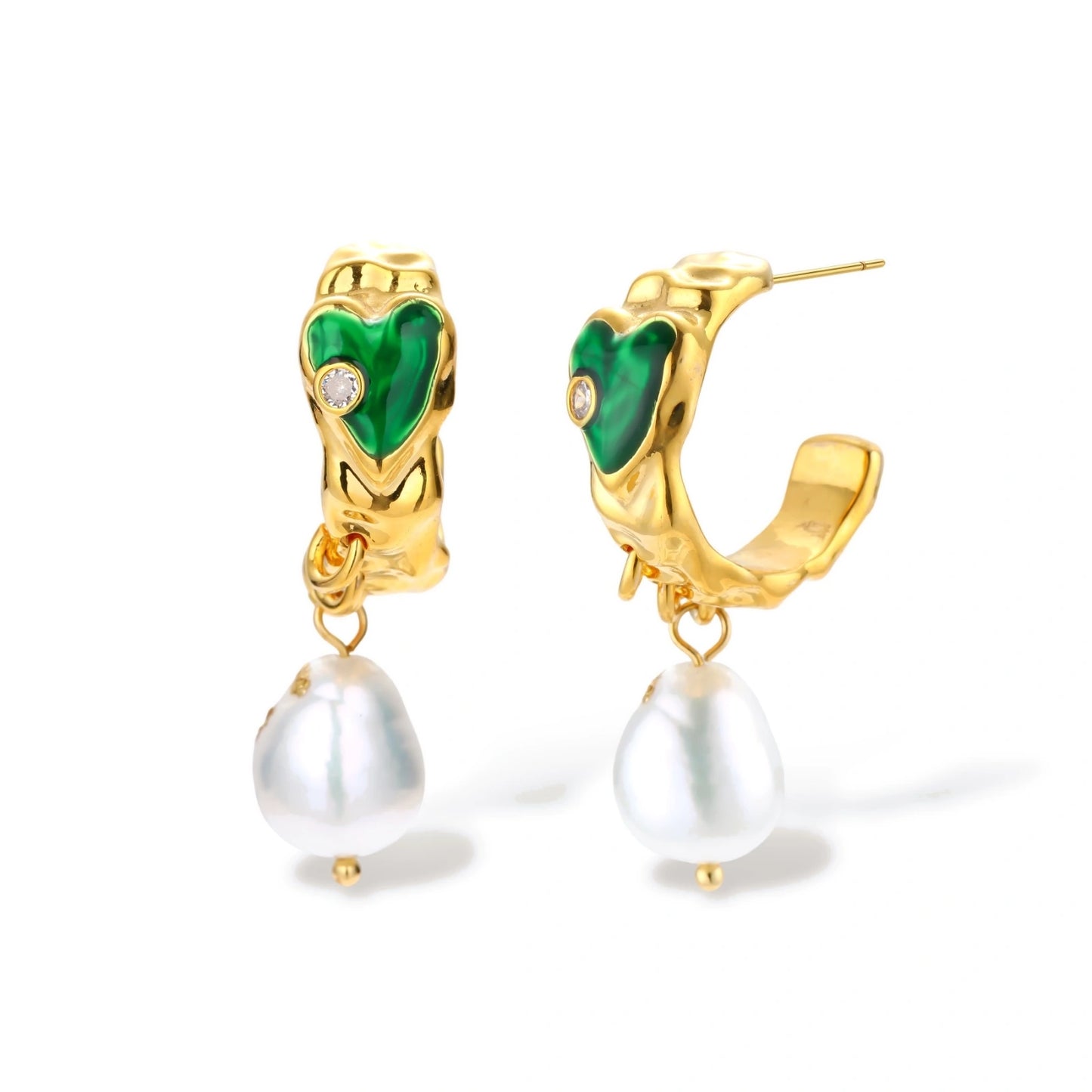 Pearl heart earrings on white background