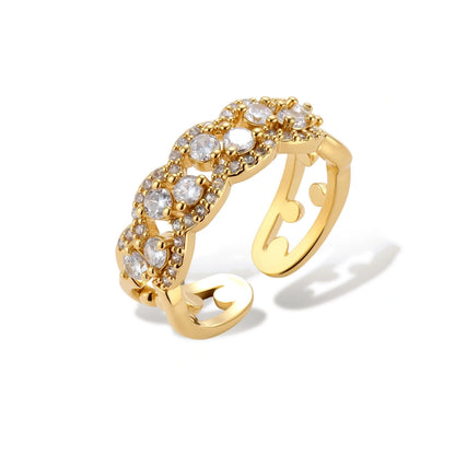 Cosima Cluster Chain Ring, gold-tone chain-link ring with zirconia stones, front view