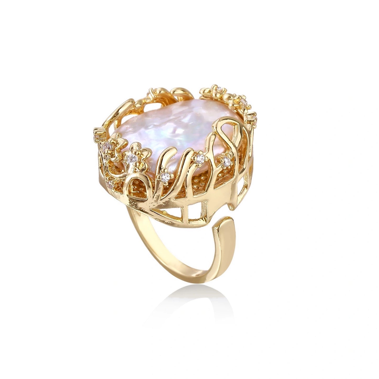 Gold ring with a large central baroque pearl on a white background