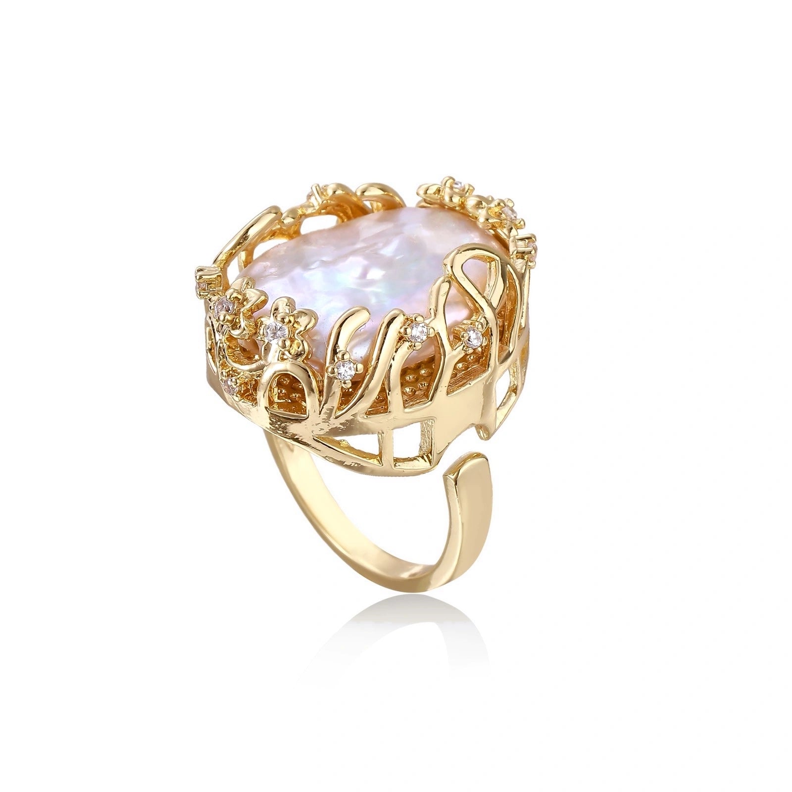 Gold ring with a large central baroque pearl on a white background