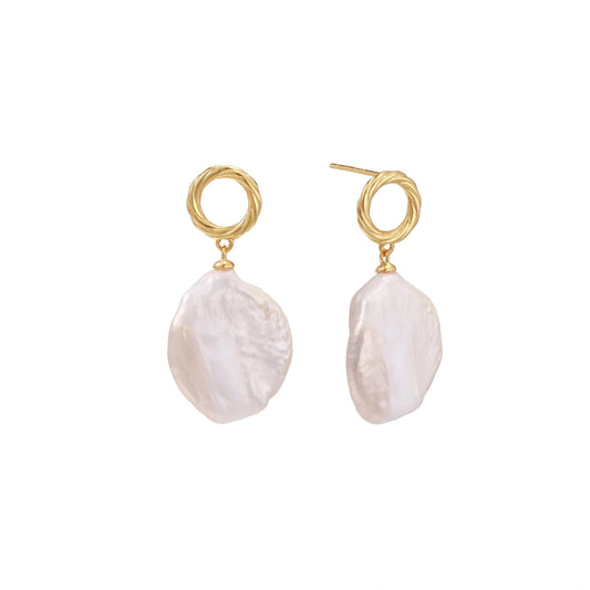 Pair of gold hoop earrings with white pearl drops on a white background