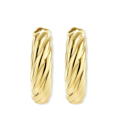 twisted gold huggie hoops on a white background