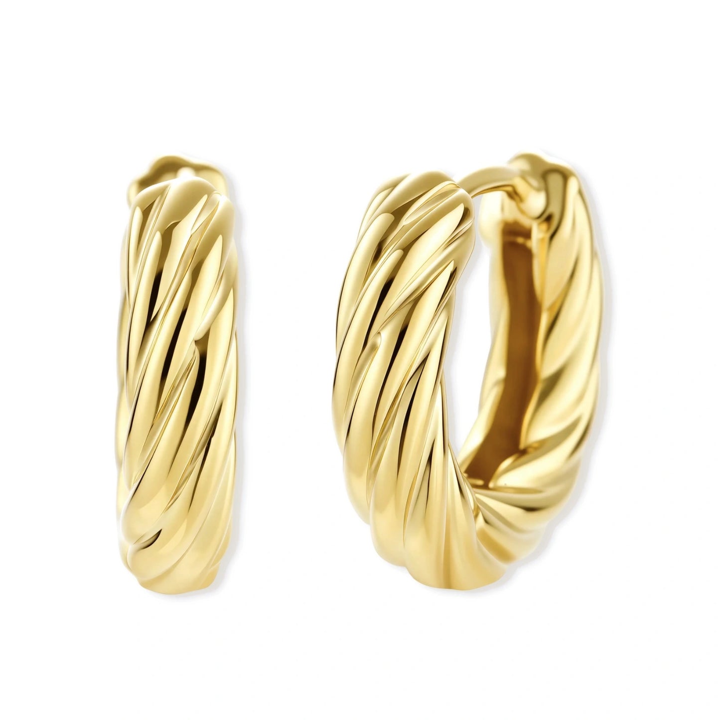 twisted gold huggie hoops on a white background