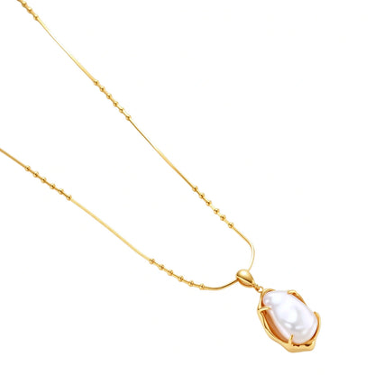 Gold necklace with a pearl pendant on a white background