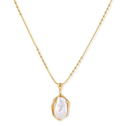 Gold necklace with a white pendant on a white background