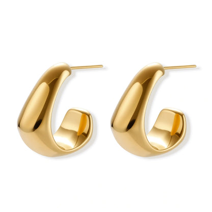 Gold hoop earrings on a white background