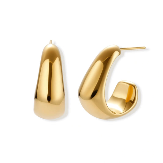 Gold hoop earrings on a white background